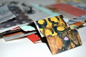 Artist's mood board showing papers cut from magazines